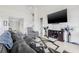 Comfortable living room featuring neutral walls, tiled flooring, and a contemporary design aesthetic at 11917 Greenchop Pl, Riverview, FL 33579