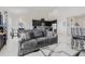 Open living room with modern decor flows into kitchen area and breakfast nook at 11917 Greenchop Pl, Riverview, FL 33579