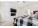 Beautiful main bedroom with a modern fireplace and large wall-mounted television at 11917 Greenchop Pl, Riverview, FL 33579