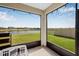 Covered patio offering serene water views and string lights at 11917 Greenchop Pl, Riverview, FL 33579