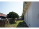 View of backyard showing fence line and exterior wall at 12349 Wasatch Ct, New Port Richey, FL 34654