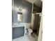 Bathroom with modern vanity, toilet, and glass-enclosed shower at 12349 Wasatch Ct, New Port Richey, FL 34654