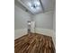 Inviting bedroom with natural light, white wainscoting, and attractive wood flooring at 12349 Wasatch Ct, New Port Richey, FL 34654