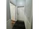 Hallway with white trim, flooring, and doorways at 12349 Wasatch Ct, New Port Richey, FL 34654
