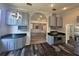 View of kitchen with stainless steel appliances, granite countertops and modern lighting fixtures at 12349 Wasatch Ct, New Port Richey, FL 34654