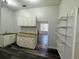 Spacious kitchen featuring cabinetry, countertops, and flooring at 12349 Wasatch Ct, New Port Richey, FL 34654