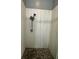 Shower with square shower head, textured walls, and tiled flooring at 12349 Wasatch Ct, New Port Richey, FL 34654
