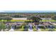 Community aerial showcasing well-maintained homes, mature trees, and convenient highway access at 12426 Dawn Vista Dr, Riverview, FL 33578