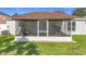 Back exterior view of screened patio at 12426 Dawn Vista Dr, Riverview, FL 33578