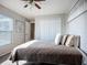 Cozy bedroom featuring a comfortable bed, decorative pillows, and ample closet space at 12426 Dawn Vista Dr, Riverview, FL 33578