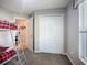 Bedroom featuring a bunk bed, closet, and window at 12426 Dawn Vista Dr, Riverview, FL 33578