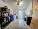 Open garage space with storage shelves and door leading to interior at 12426 Dawn Vista Dr, Riverview, FL 33578