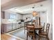 Updated kitchen and breakfast nook area featuring stainless steel appliances, granite counters and a stylish pendant light at 12426 Dawn Vista Dr, Riverview, FL 33578