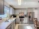 Bright kitchen area featuring stainless steel appliances, granite counters and pendant lighting at 12426 Dawn Vista Dr, Riverview, FL 33578