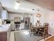 Updated kitchen and breakfast nook area featuring stainless steel appliances, granite counters and a stylish pendant light at 12426 Dawn Vista Dr, Riverview, FL 33578