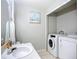 Laundry area in bathroom with washer and dryer units at 12426 Dawn Vista Dr, Riverview, FL 33578