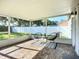 Screened patio with brick floor and outdoor seating at 12426 Dawn Vista Dr, Riverview, FL 33578