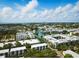 Showcases a location near a bay, with the city skyline in the background, under a blue sky dotted with fluffy clouds at 1316 W Carmen St # 2, Tampa, FL 33606