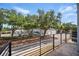 Balcony overlooking quiet street with lush trees, providing a serene outdoor space at 1316 W Carmen St # 2, Tampa, FL 33606