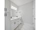 Modern bathroom with double sinks, stylish vanities, and ample storage at 1316 W Carmen St # 2, Tampa, FL 33606
