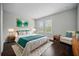 Bright bedroom with large windows, hardwood floors, and stylish décor, offering a comfortable retreat at 1316 W Carmen St # 2, Tampa, FL 33606