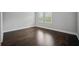 Spacious empty room with hardwood floors and bright windows, ready for customization at 1316 W Carmen St # 2, Tampa, FL 33606