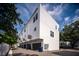 Modern townhome exterior featuring clean lines, multiple stories, and individual garages at 1316 W Carmen St # 2, Tampa, FL 33606
