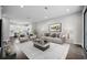 Living room with modern furnishings, a decorative painting, and an open kitchen, creating an inviting and stylish space at 1316 W Carmen St # 2, Tampa, FL 33606