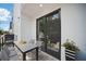 Cozy outdoor patio with table, seating, and sliding glass doors, perfect for relaxing and entertaining at 1316 W Carmen St # 2, Tampa, FL 33606