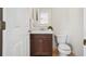 Bathroom with a wood vanity and framed mirror at 13310 Thoroughbred Loop, Largo, FL 33773