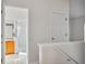 Entryway to bathroom featuring shower and sink, next to stairway at 13310 Thoroughbred Loop, Largo, FL 33773