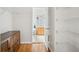Walk-in closet with hardwood floors and wire shelving with bathroom view at 13310 Thoroughbred Loop, Largo, FL 33773