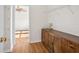 Walk-in closet with hardwood floors, wooden dresser and wire shelving at 13310 Thoroughbred Loop, Largo, FL 33773