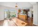 Dining area with sliding glass doors to enclosed patio and open to the kitchen at 13310 Thoroughbred Loop, Largo, FL 33773