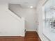 Bright entryway with staircase and natural light from the window at 13310 Thoroughbred Loop, Largo, FL 33773
