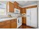 Well-equipped kitchen with white appliances and plenty of storage at 13310 Thoroughbred Loop, Largo, FL 33773