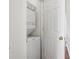 Laundry closet with stacked washer and dryer at 13310 Thoroughbred Loop, Largo, FL 33773