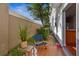 Cozy patio with seating and a view of the surrounding greenery at 13310 Thoroughbred Loop, Largo, FL 33773