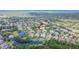 Sprawling aerial shot featuring a stunning home in a tranquil community with picturesque ponds and lush trees at 16406 Chapman Crossing Dr, Lithia, FL 33547