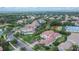 A picturesque aerial view showcasing the beautiful home nestled in a serene neighborhood with lush greenery at 16406 Chapman Crossing Dr, Lithia, FL 33547