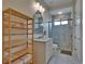 Beautiful bathroom with a walk-in shower, shelving and modern fixtures, providing a relaxing space at 16406 Chapman Crossing Dr, Lithia, FL 33547