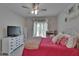 Nicely decorated bedroom with a decorative bed, a large window, and matching furniture at 16406 Chapman Crossing Dr, Lithia, FL 33547
