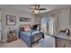 Comfortable bedroom with balcony access, natural light, and casual decor for a  at 16406 Chapman Crossing Dr, Lithia, FL 33547