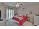 Lovely bedroom featuring natural light, a decorative wall, and a comfy bed at 16406 Chapman Crossing Dr, Lithia, FL 33547