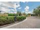 Well-maintained community entrance with lush landscaping at 16406 Chapman Crossing Dr, Lithia, FL 33547