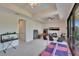 Spacious game room featuring neutral walls, carpeted floors, an aquarium, and fun games for  at 16406 Chapman Crossing Dr, Lithia, FL 33547