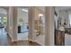 Hallway with views into the laundry room and bathroom area at 16406 Chapman Crossing Dr, Lithia, FL 33547