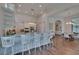 Spacious white kitchen with a large island, stainless steel appliances, and adjacent dining area at 16406 Chapman Crossing Dr, Lithia, FL 33547