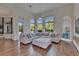 Open-concept living area with expansive windows, comfortable seating, and views of the pool area at 16406 Chapman Crossing Dr, Lithia, FL 33547