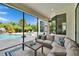 Inviting covered patio features comfortable seating and a view of the pool at 16406 Chapman Crossing Dr, Lithia, FL 33547